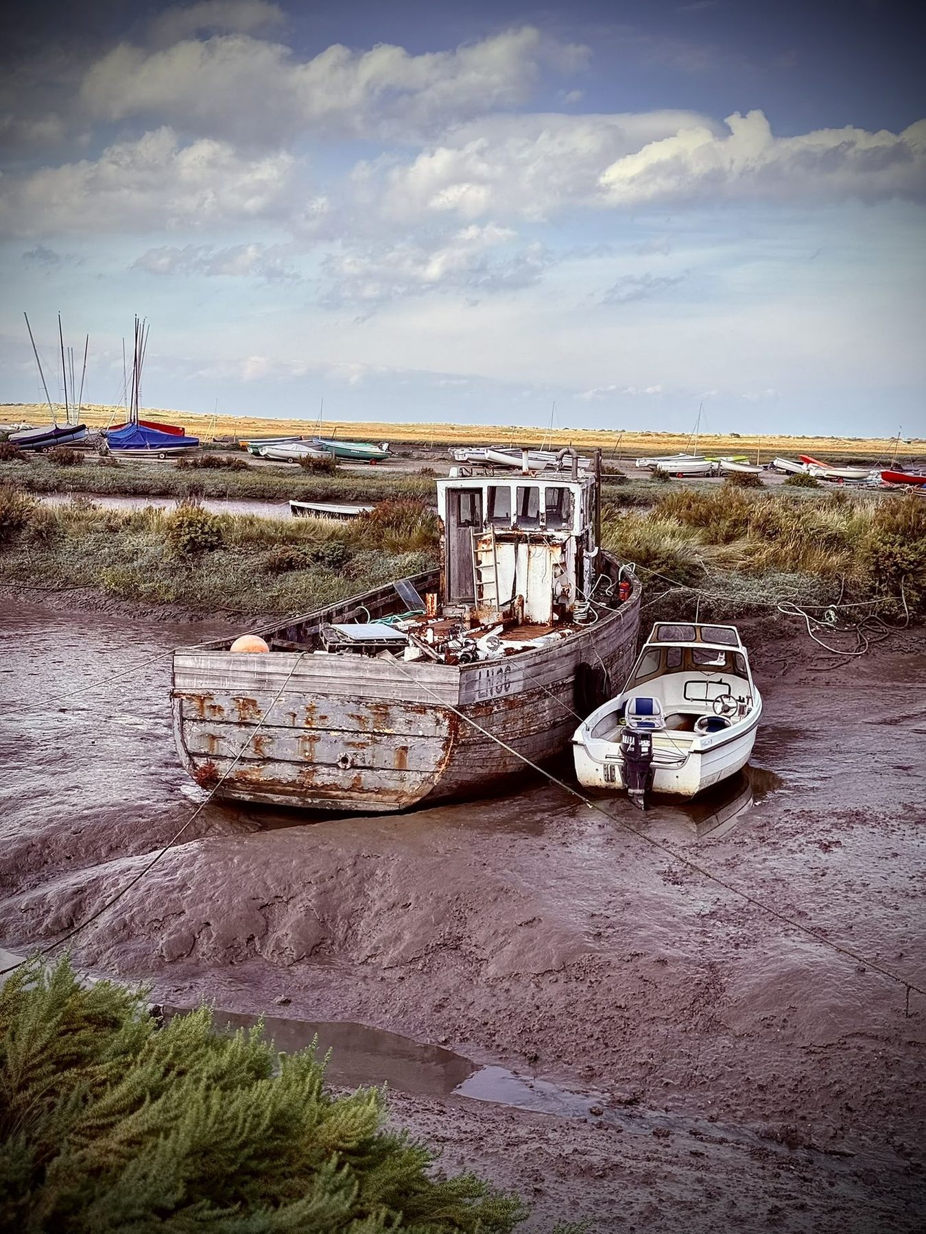Brancaster Staithe Norfolk — traditional fishing boats at low tide, Em Films Norfolk